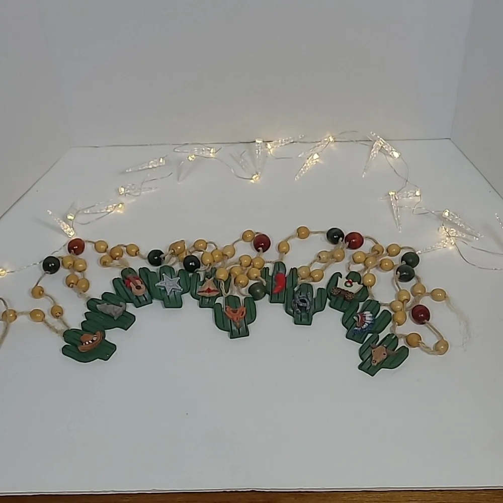 Vintage resin cactus western Christmas garland. Approximately 85 inches long